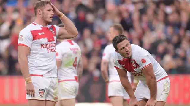 Tom Burgess and Sam Burgess of England look dejected