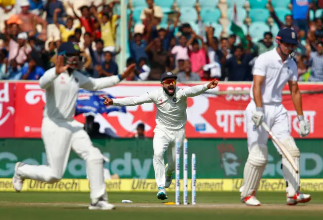 India captain Virat Kohli celebrates the dismissal of England captain Alastair Cook