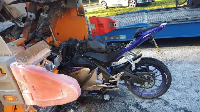 Motorcycle and bin lorry