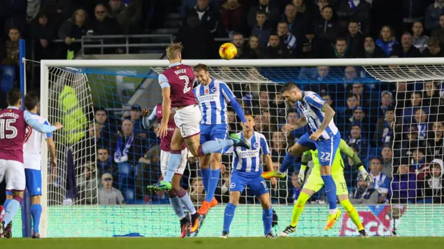 Aston Villa's Nathan Baker scores with a header