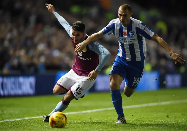 Steve Sidwell of Brighton (R) challenges Ashley Westwood of Aston Villa