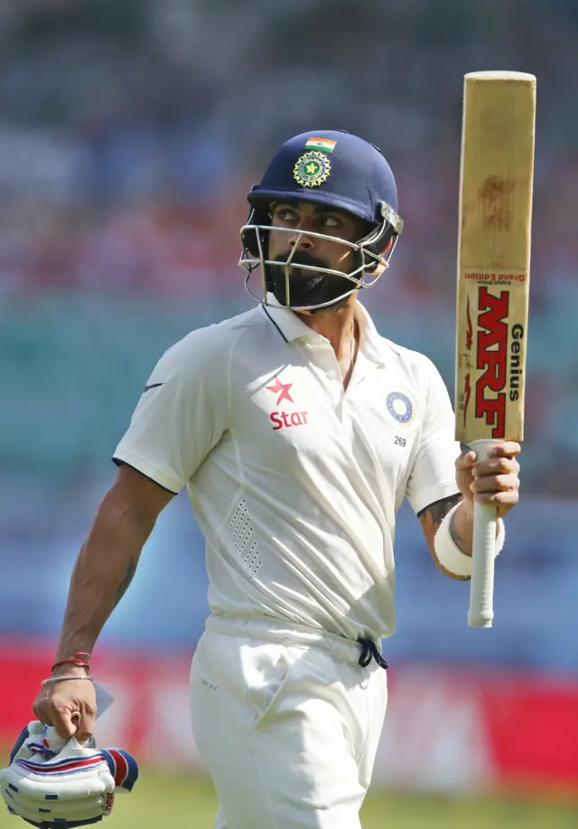 India's captain Virat Kohli acknowledges applause from the crowds as he leaves the pitch