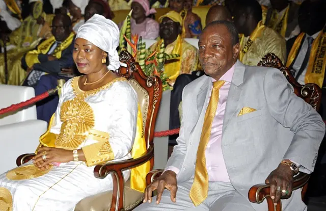 Guinea's President Alpha Conde (R) and his wife Hadja Djene Kaba Conde attend Conde's Rally of the Guinean People (RPG) party conference on August 11, 2015 in Conakry