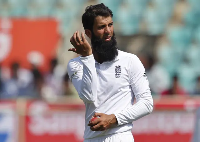 Moeen Ali gestures before bowling