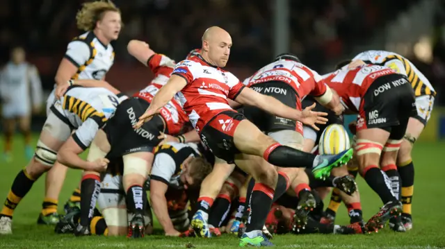 Willi Heinz (c) of Gloucester Rugby kicks the ball clear.