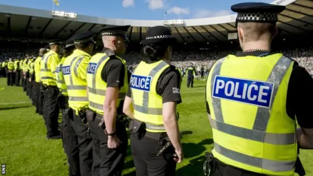 Police formed an armed guard after supporters invaded the pitch