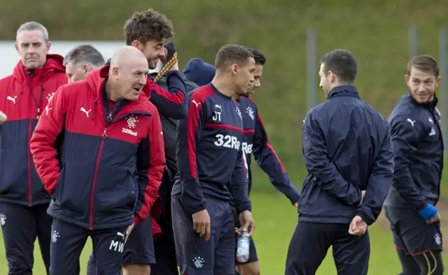 Mark Warburton's shares a joke with his Rangers squad in training