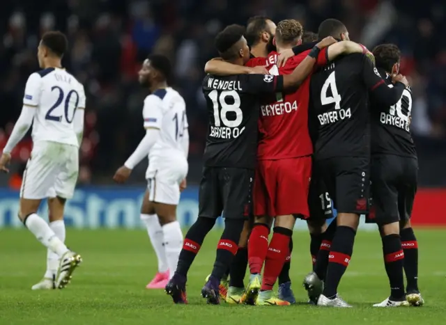 Bayer Leverkusen players celebrate at full-time