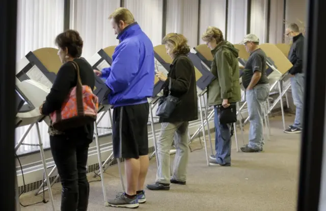 People vote during early voting for the 2016 General Election at the Salt Lake County Government Center Tuesday, 1 November 2016, in Salt Lake City.