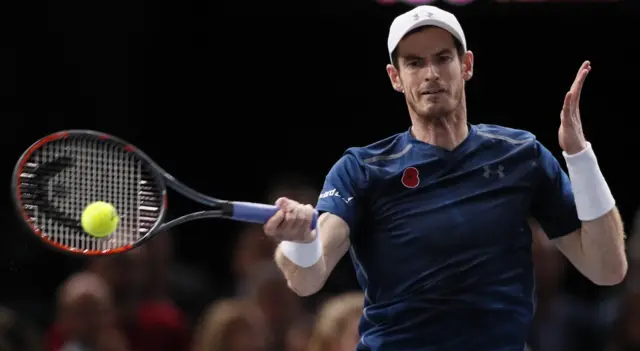 Andy Murray hits a return shot