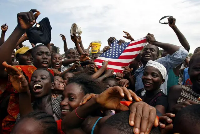 Liberians celebrates with an American flag