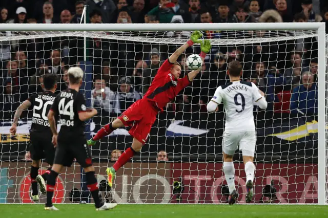 Bernd Leno makes an attempted diving save