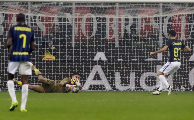 Gianluigi Donnarumma makes a save