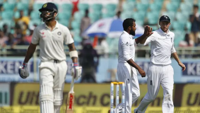 England's Rashid celebrates the wicket of India's Virat Kohli