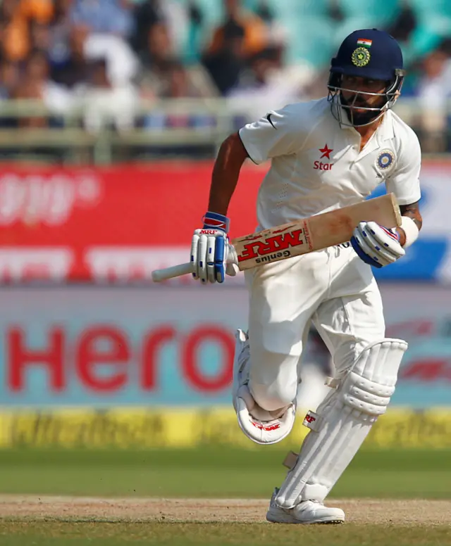 India's Virat Kohli runs between the wicket