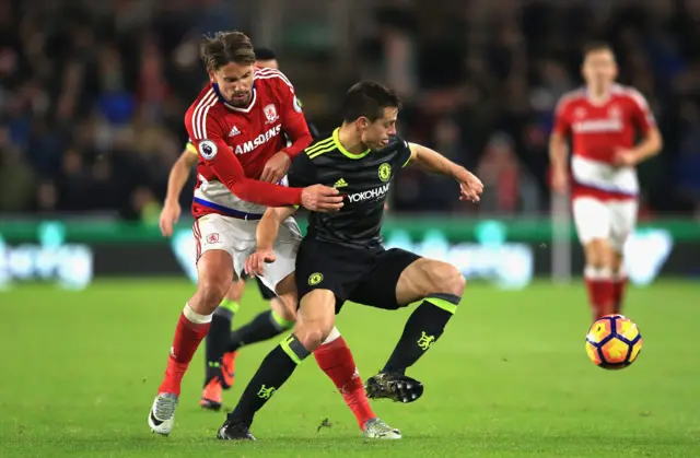 Cesar Azpilicueta of Chelsea is challenged by Gaston Ramirez