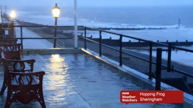 Wet promenade, with the sea beyond