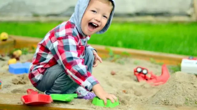 Child playing in sand