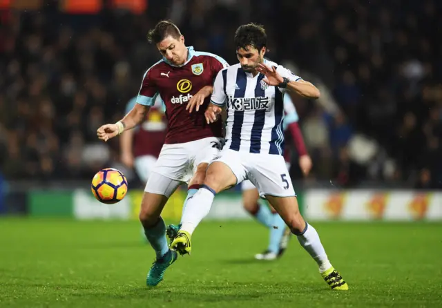 Stephen Ward of Burnley and Claudio Yacob