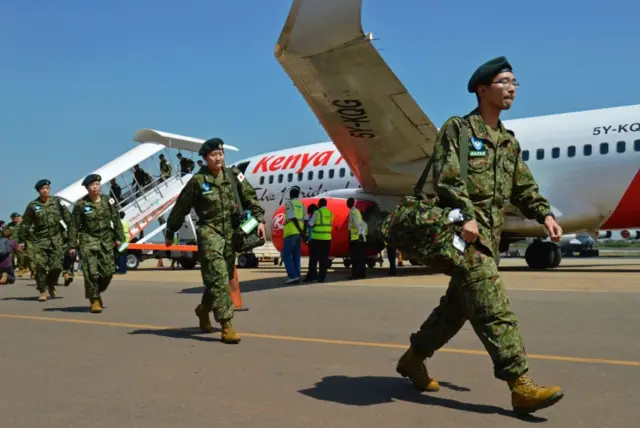 Members of the Japanese Ground Self-Defence Force (GSDF) arrive at the airport in Juba, South Sudan, on November 21, 2016.