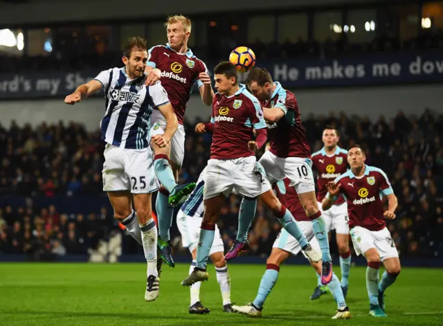 Craig Dawson jumps for the ball