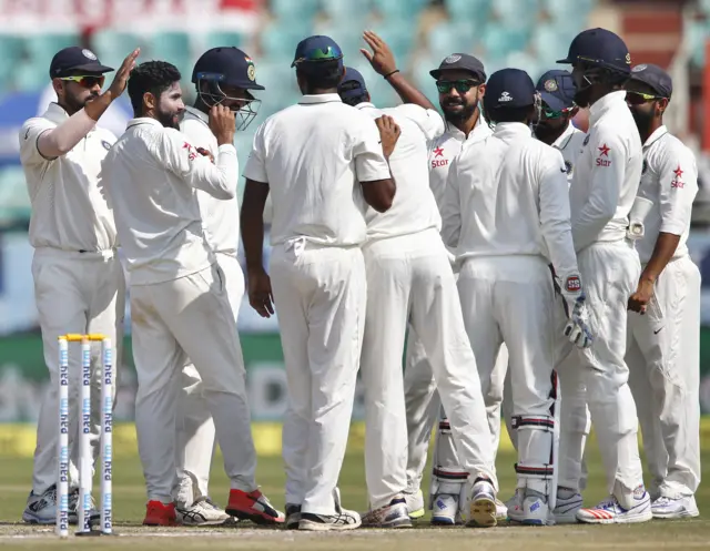 India celebrate the wicket of Moeen Ali