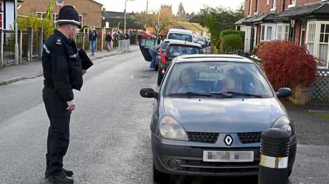 Policeman with car