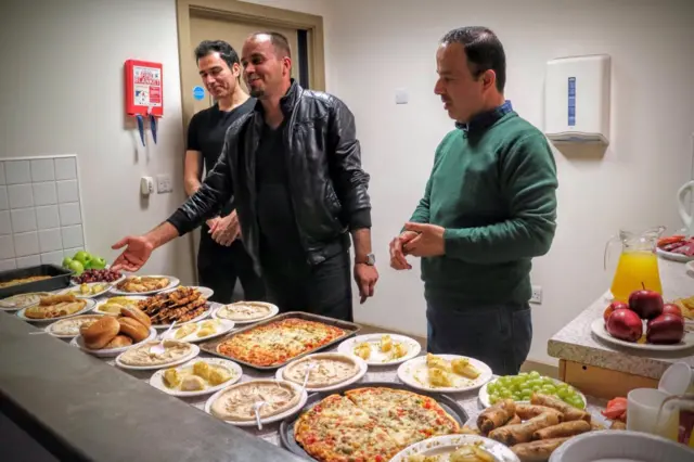 Adnan Khalil Omar (centre) with two unnamed men