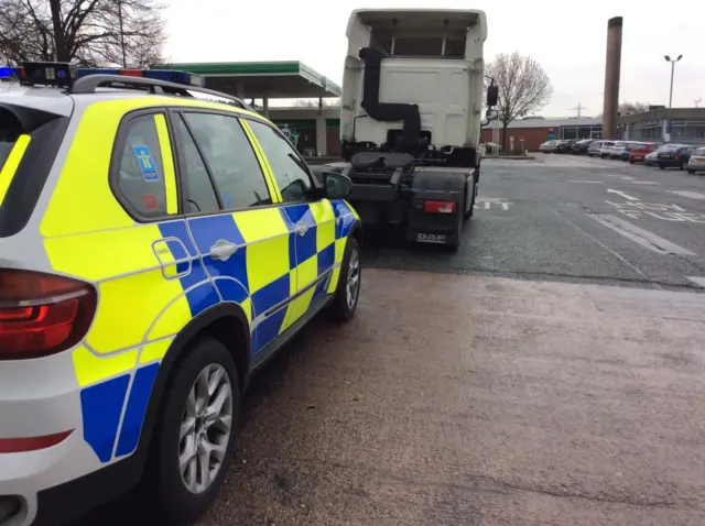 Police car and lorry