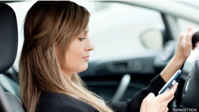 Driver using mobile phone while driving