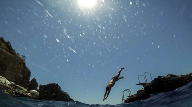 Man diving into pool