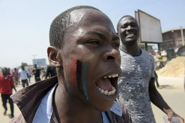 A pro-Biafra supporter chants a song in Aba, southeastern Nigeria, during a protest calling for the release of a key activist on November 18, 2015.