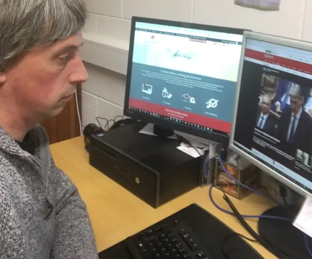 Federation of Small Businesses branch chairman Ian O'Donnell watches the Autumn Statement