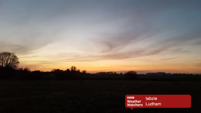 Sunset at Ludham - pink and gold skies over dark countryside