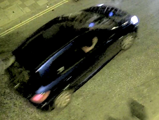 Still-frame from police footage of a blue car used in the incident