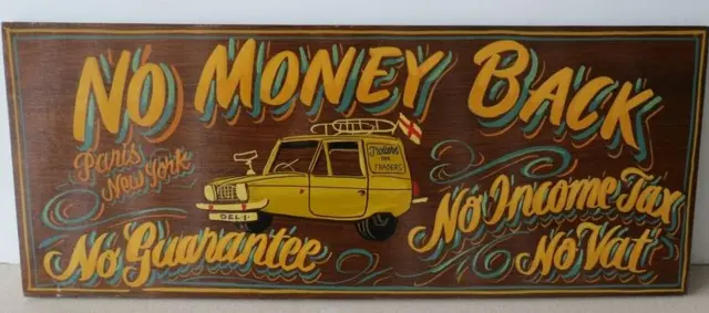 "No Money Back" sign, depicting the Trotter's yellow three wheeler van