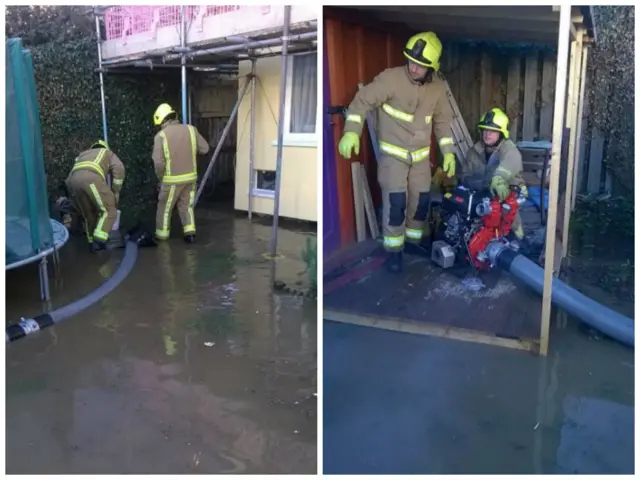 Firefighters pump water from front gardens