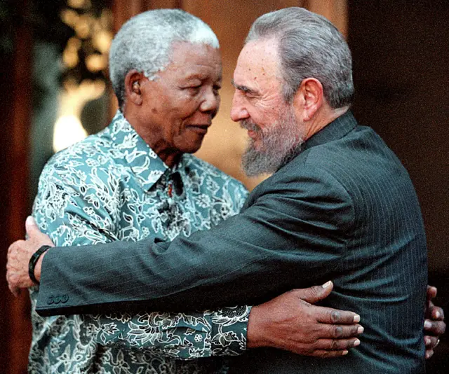 Nelson Mandela and Fidel Castro embrace in Johannesburg in 2001