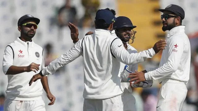 India's players celebrate the wicket of Ben Stokes