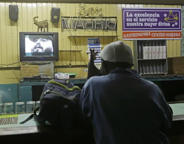 Man watches TV broadcast in Havana, Cuba