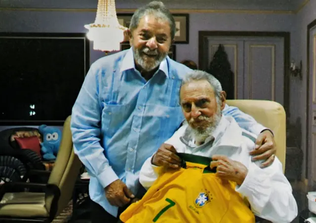 This handout photo taken and released by the Instituto Lula on February 25, 2014 in Havana shows former Brazilian President Luiz Inacio Lula da Silva (L) embracing former Cuban leader Fidel Castro after giving him a Brazilian national football team jersey as a present.