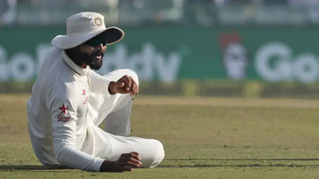 Ravi Jadeja reacts after missing a chance to catch Alastair Cook