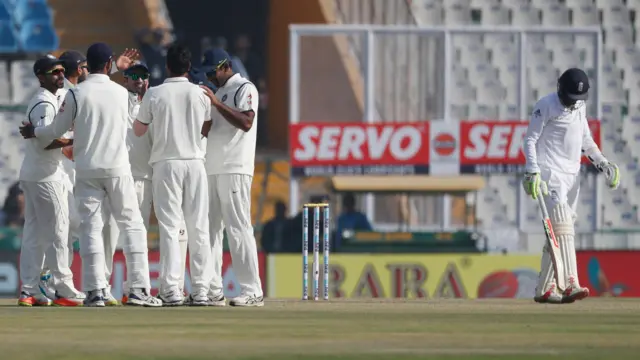 India's players celebrate the wicket of Haseeb Hameed