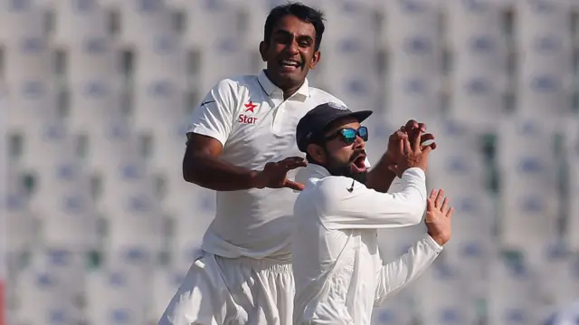 Jayant Yadav and Virat Kohli celebrate