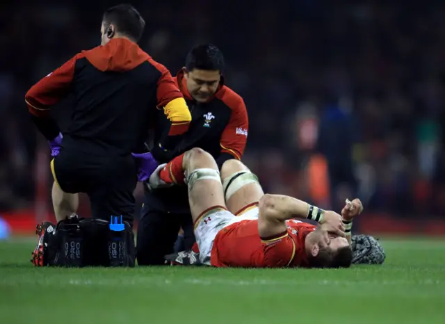 Dan Lydiate is treated for an injury