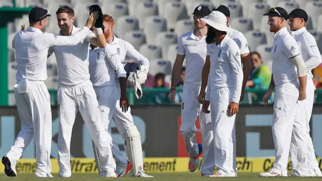 England's players celebrate a wicket