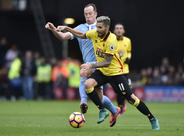 Charlie Adam challenges for the ball