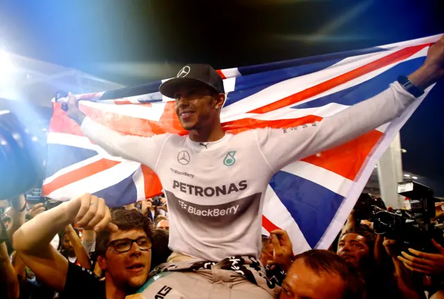 Lewis Hamilton celebrates winning the 2014 world title