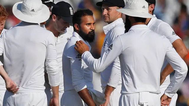 England's players celebrate a wicket