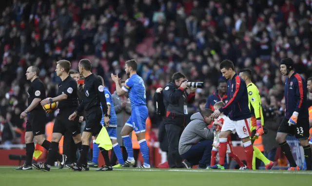 The teams enter the Emirates